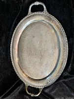 Full view of silver-plated oval tray showing overall form and handles