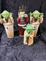 Front view of Yoda puppet and three collector cups with Yoda and Nute Gunray toppers