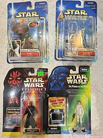 Front view of all four sealed Star Wars action figures