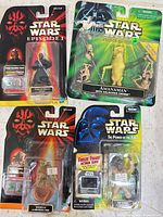 Front view of all four sealed Star Wars figures