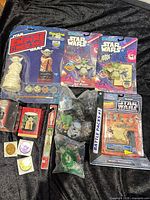 Group shot of all Yoda collectibles in packaging