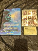 Front view of MasterVisions card set box, stamp block, and COA
