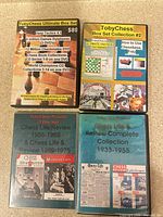 Four TobyChess DVD cases laid out front covers visible