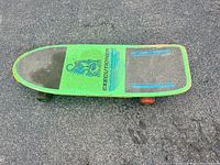 Top view showing grip-tape pads, scorpion graphic and wheel colours