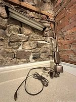 Lamp full view on countertop showing arm, head, cord