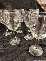 Group view of six clear glass wine glasses