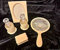 Full view of all five pieces on black background