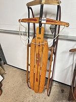 Full view of Flexible Flyer Airline Chief wooden runner sled standing upright