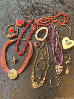 Overview of entire jewelry lot on dark background