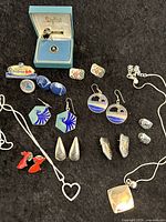 Overview of all jewelry pieces on black background