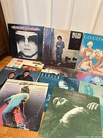 Group shot of multiple album covers laid out, showing Elton John, Billy Joel, Go-Go’s and others