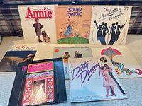 Front covers of nine LP records arranged upright and flat