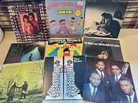 Group shot of all eight album fronts