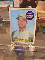 Front view of 1969 Topps Reggie Jackson card on stand