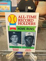 Front of Topps card showing Roger Maris and Hank Aaron