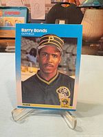 Front of Barry Bonds Fleer rookie card on stand