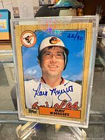 Front view of autographed 1987 Topps Ray Knight card in holder