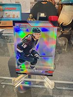Front of Markus Naslund Bowman Chrome Refractor card displaying holographic finish and jersey number 19