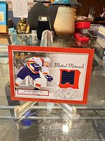 Front of card showing player image and jersey swatch