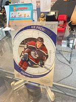 Front of 2005/06 Upper Deck Ice Premieres Rick Rypien rookie card on stand