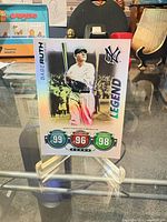 Full front view of Babe Ruth holographic Topps Attax card on stand
