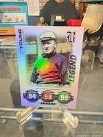 Front view of Cy Young Legend holographic trading card on stand