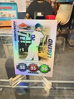 Full front view of 2010 Topps Jackie Robinson holographic foil insert card on stand