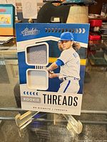 Front view of card showing design and two jersey swatches