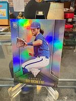 Front view showing holographic refractor finish and player pose