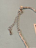 Detail of extender end with teardrop charm