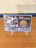 Front view of bronze medallion card in case