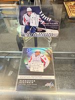 Both Ovechkin trading cards displayed in holders, showing overall condition and stickers