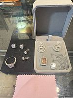 Overall view of all jewelry pieces on foam and in box