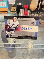 Front view of autographed Ryan Kesler Upper Deck Trilogy card on acrylic easel