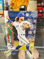 Front view of Bo Bichette 2020 Topps Holiday rookie card showing snowflake design and RC logo