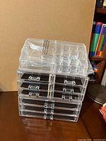 Set assembled showing top tray on two drawer units, all wrapped