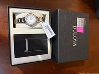 Bulova watch and necklace set in original box with outer lid visible