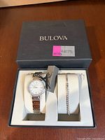 Bulova branded gift box containing watch and bracelet set