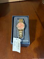 Watch in box with tag visible