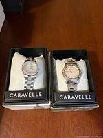Both Caravelle watches side by side in boxes