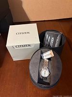 Citizen watch in presentation box with tag and outer box visible