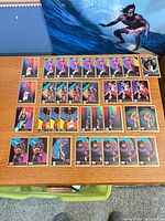 All 36 SkyBox NBA cards laid out on table