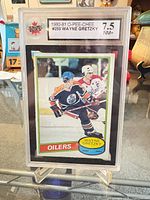 Front view of encapsulated Gretzky O-Pee-Chee card showing image, borders, KSA slab