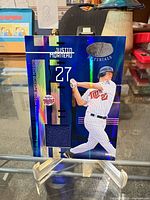 Front of holographic Justin Morneau jersey card on stand
