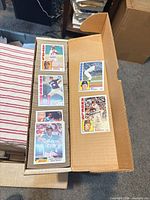 Open storage box showing several stacks of Topps baseball cards