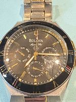 Front view of Bulova watch showing dial, bezel and bracelet