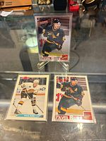 All three Pavel Bure cards in sleeves on display stand