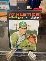 Front of 1971 Topps Rollie Fingers card on stand
