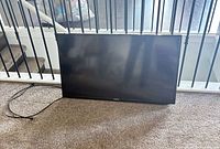 Front view of Samsung 40" TV with power cord