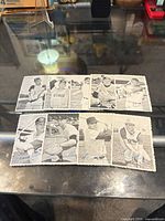 Eight T.C.G. photo cards laid out front view